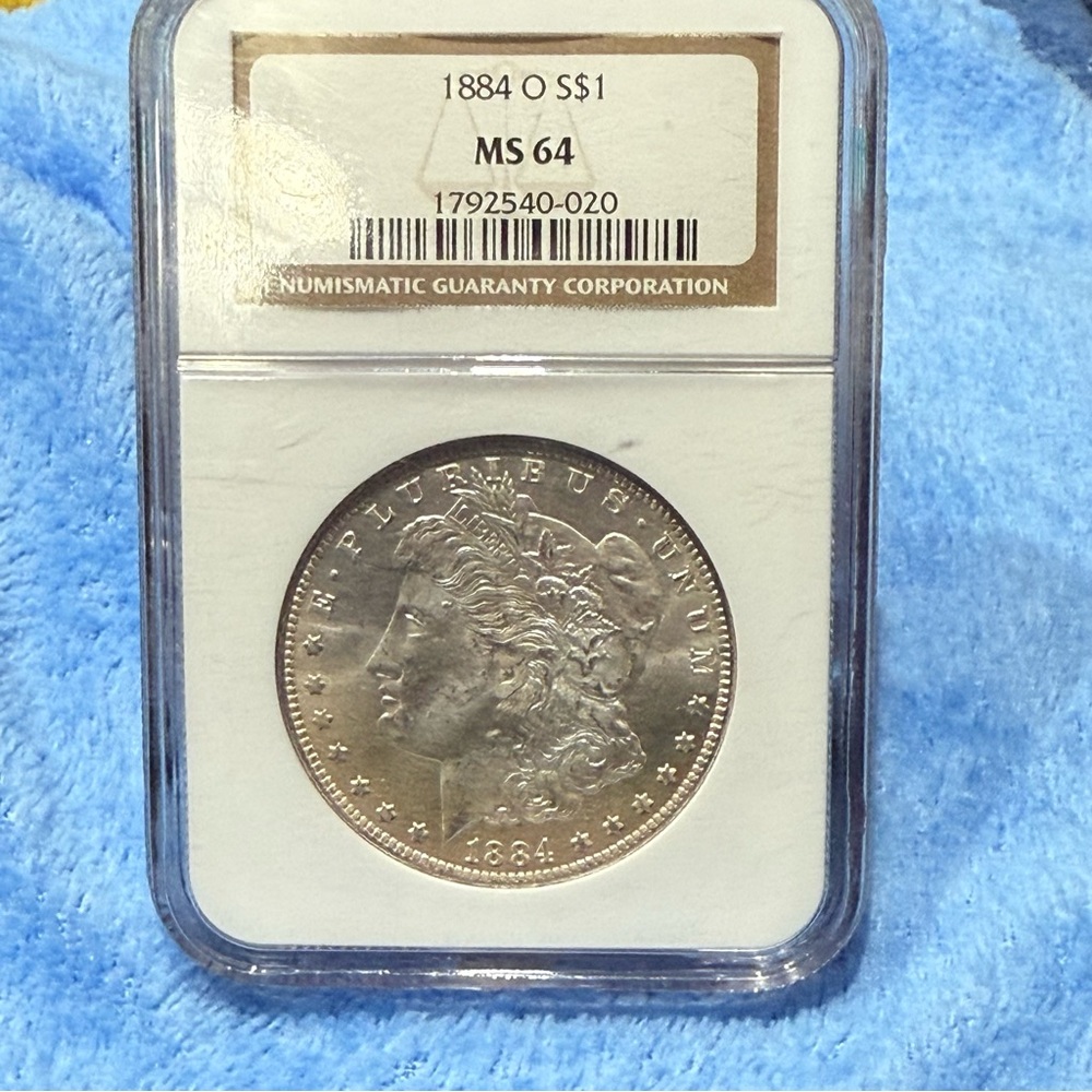 🔥1884 O Morgan Silver Dollar Gorgeous Rainbow toning🔥RARE MS 64 grade
